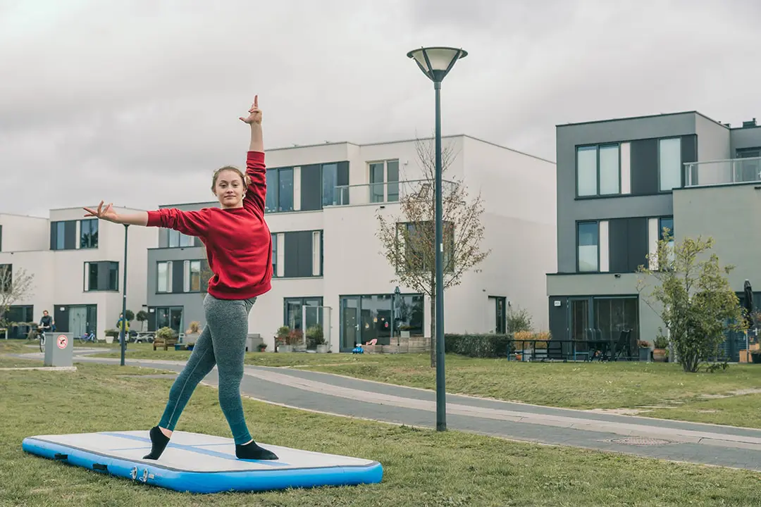 Girl practicing gymnastics on the AirTrack 3 meter AirFloor Home