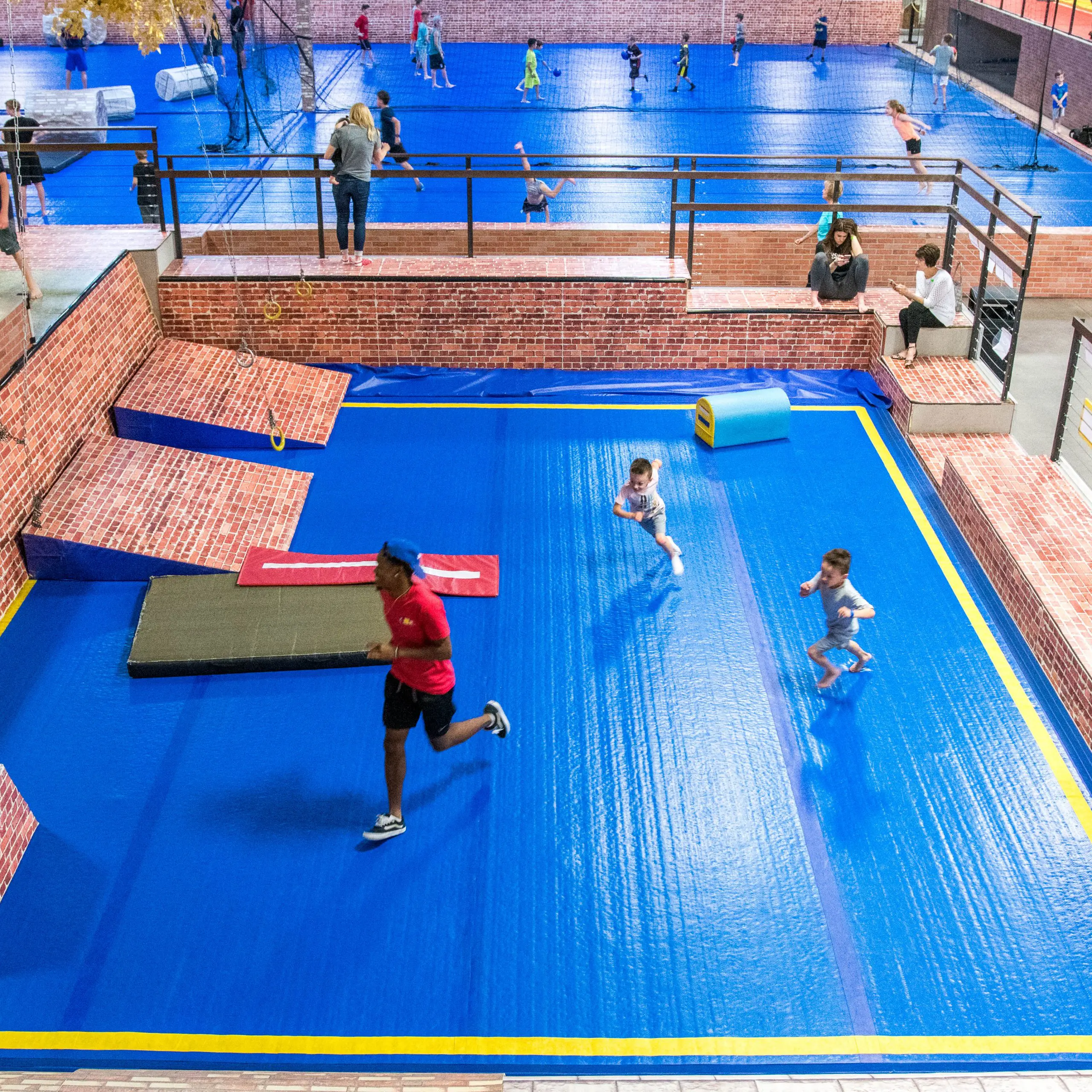 Giant blue AirTrick inside trampoline park