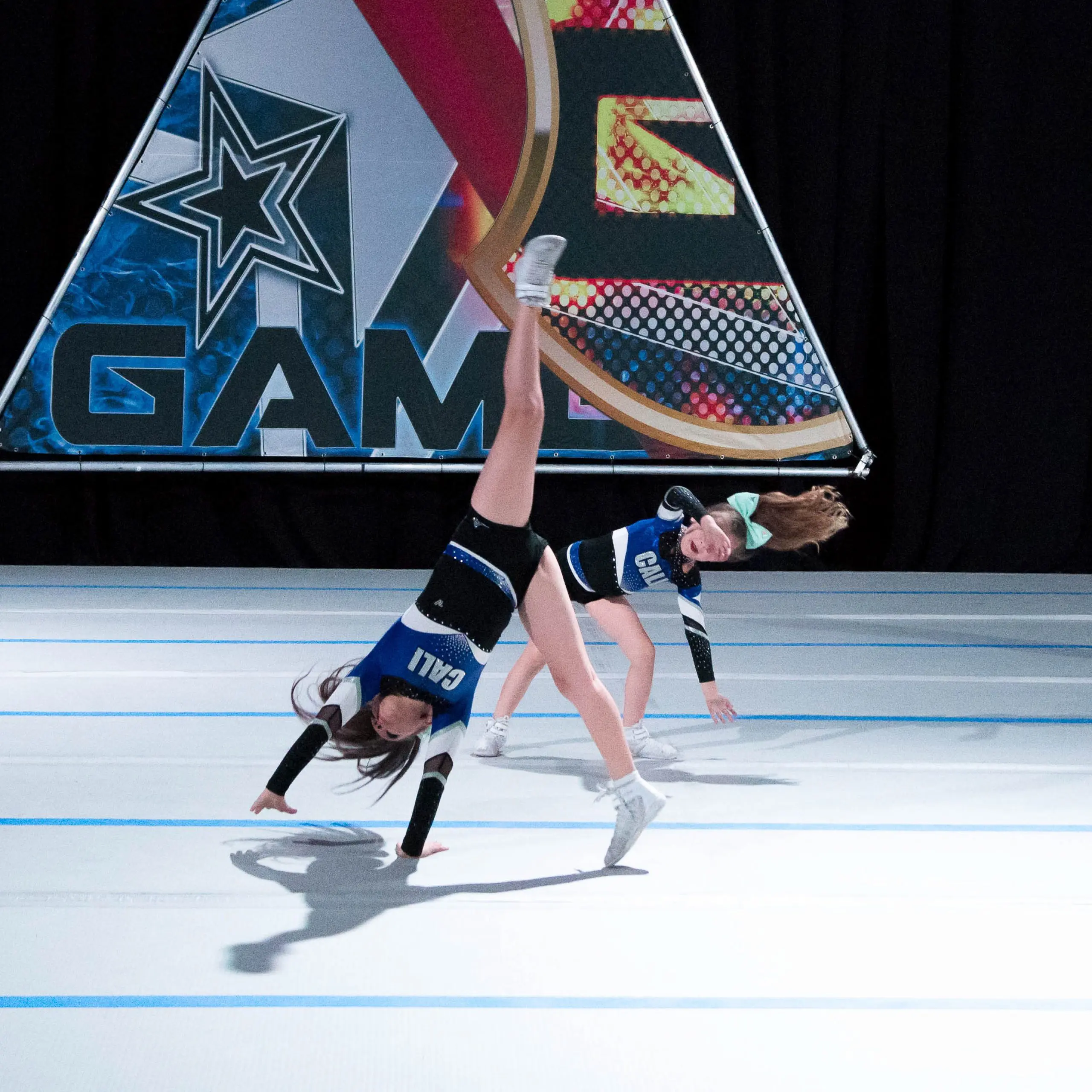 Cheerleaders tumbling on a inflatable competition floor