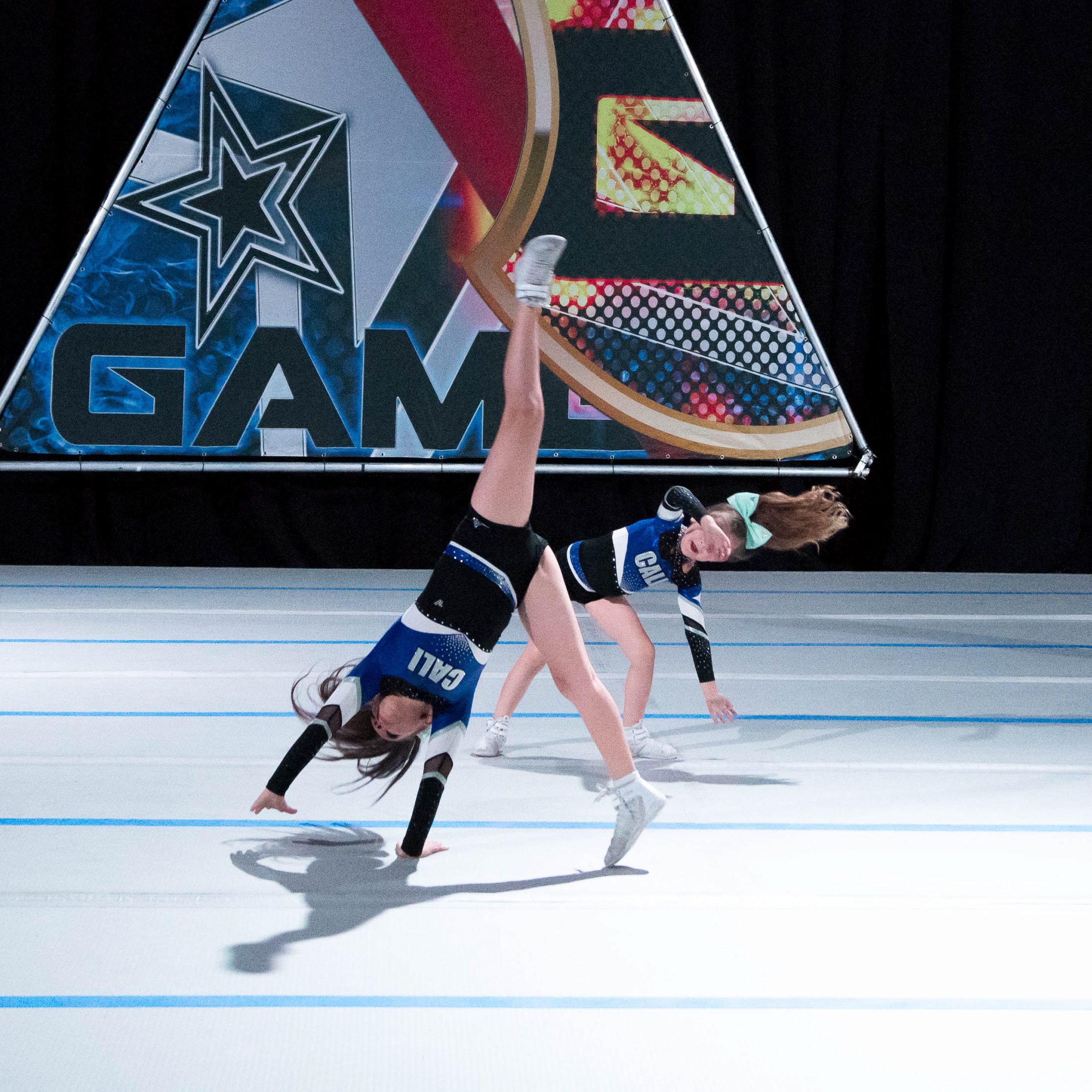Cheerleaders tumbling on a inflatable competition floor